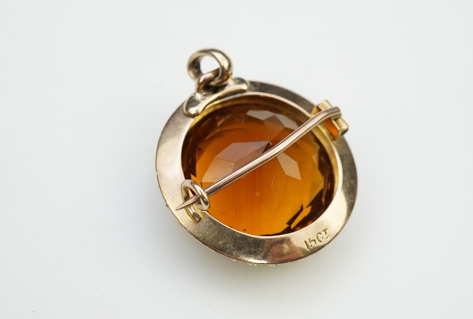 An Edwardian citrine and pearl brooch/pendant, early 20th century